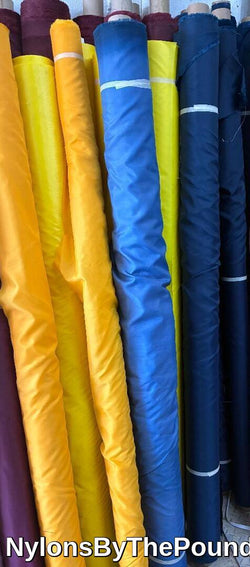 Nylon Taffeta Fabrics Water Repellent 70 Denier  60 inches wide Assorted Colors 75 cents a pound about  20 cents a yard.