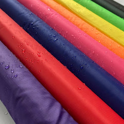 70 Denier Nylon Ripstop Fabric, Assorted Colors 10 to 20 yard rolls. Durable Water Repellent 60" wide 75 cents a pound about 18 cents a yard